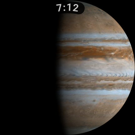 Jupiter on the watch, half in daylight, its cloud bands in real colour